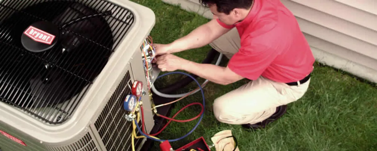 HVAC technician servicing an outdoor air conditioner unit in Easton, PA
